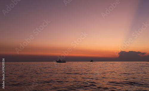 Boat. Sky. Orange. Sea. Sun. Istria