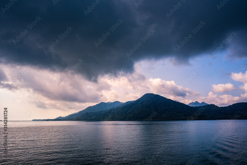 Sea and island with the rain cloud background
