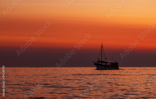 Boat. Sun. Orange. Sky. Sea. Istria