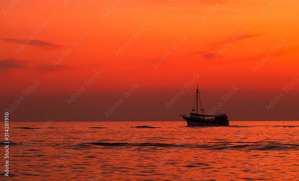 Boat. Sunset. Orange. Sky .Sea. Istria