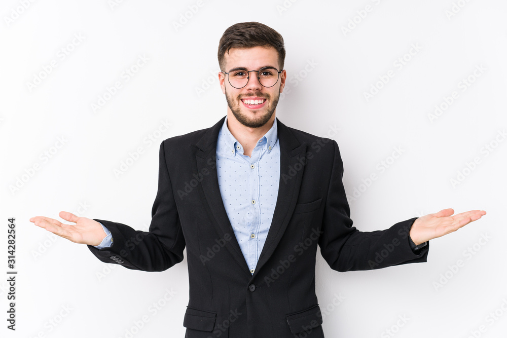 Young caucasian business man posing in a white background isolated Young caucasian business man showing a welcome expression. Young caucasian business man posing in a white background isolated Young caucasian business man showing a welcome expression.