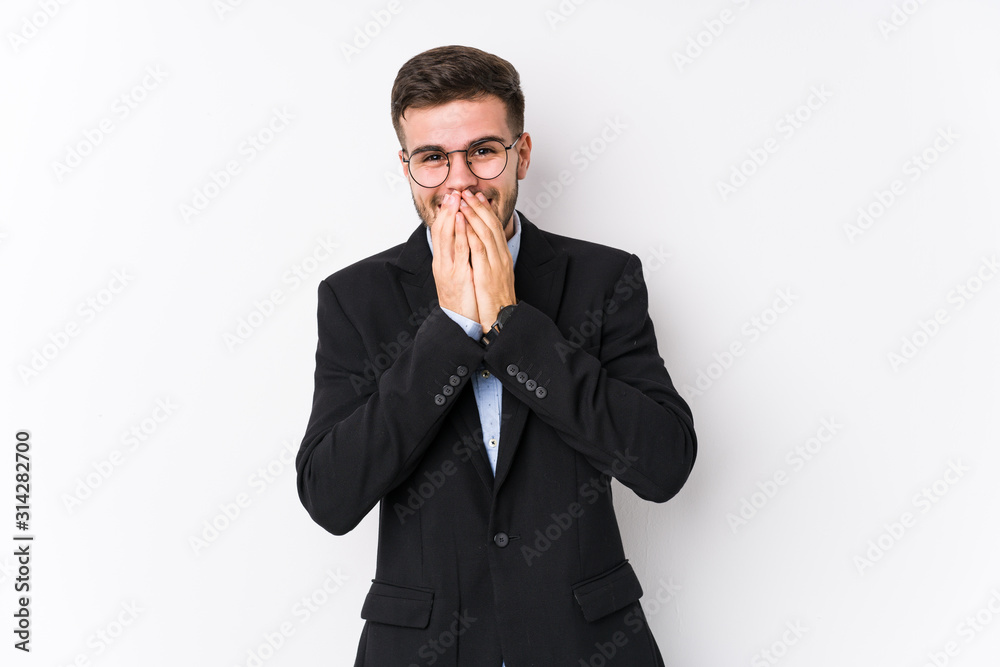 Young caucasian business man posing in a white background isolated Young caucasian business man laughing about something, covering mouth with hands. Young caucasian business man posing in a white background isolated Young caucasian business man laughing about something, covering mouth with hands.