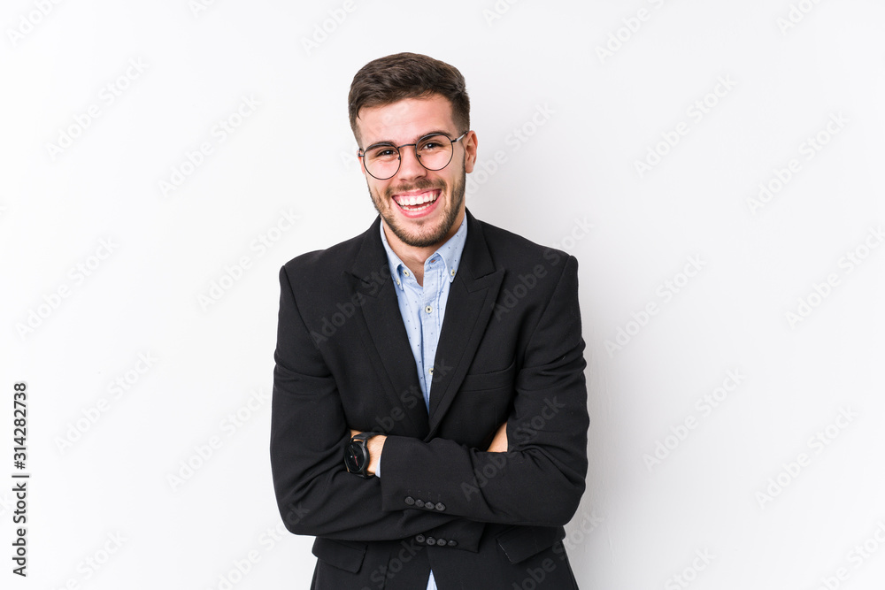 Young caucasian business man posing in a white background isolated Young caucasian business man laughing and having fun. Young caucasian business man posing in a white background isolated Young caucasian business man laughing and having fun.