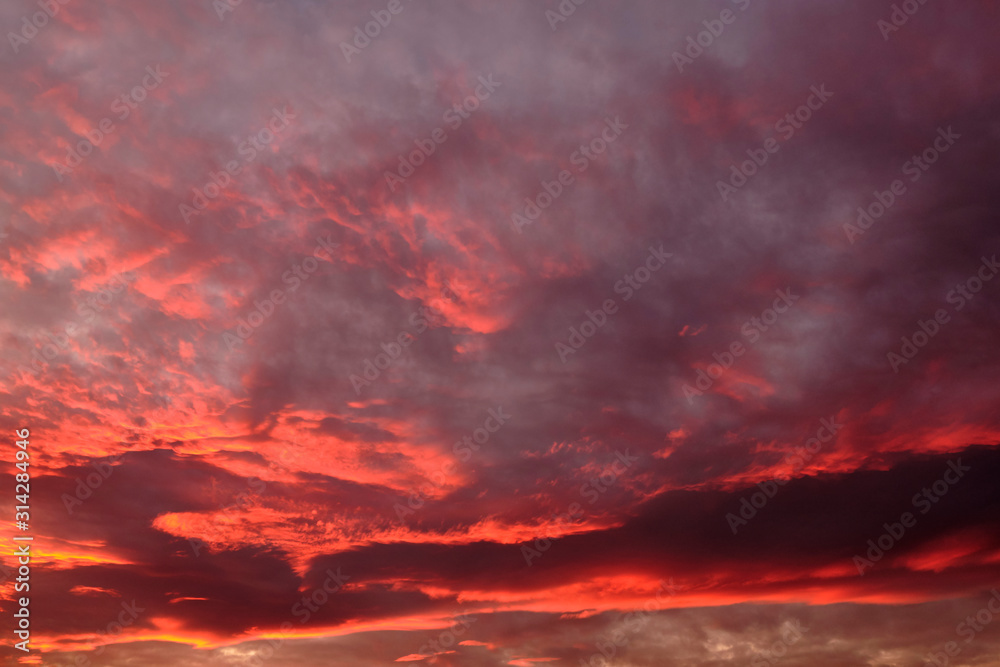 Fototapeta premium dramatic cloudy sky in the rays of setting sun