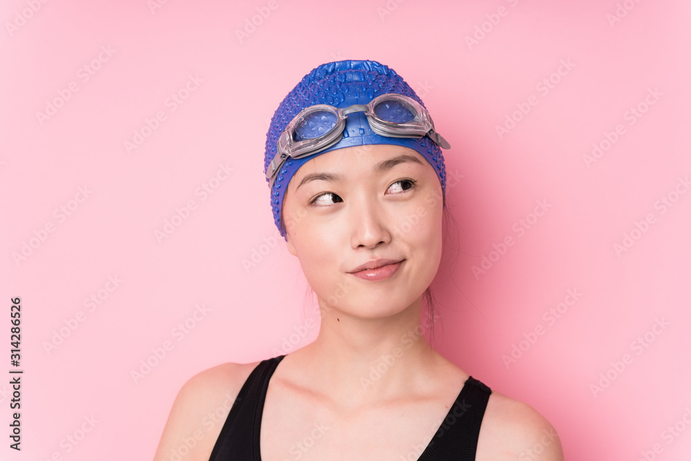 Young japanese swimmer woman face closeup isolated Young japanese swimmer woman face closeup isolated