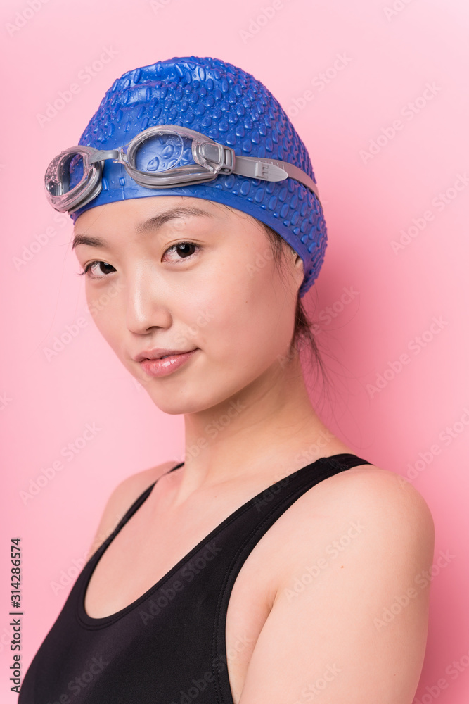 Young japanese swimmer woman face closeup isolated Young japanese swimmer woman face closeup isolated