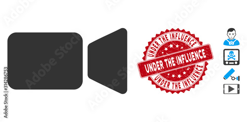 Vector movie camera icon and grunge round stamp seal with Under the Influence text. Flat movie camera icon is isolated on a white background.