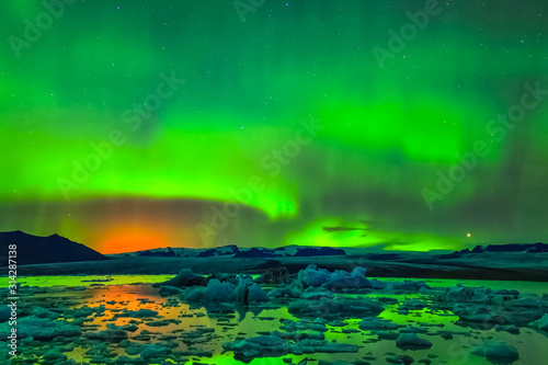Fototapeta Naklejka Na Ścianę i Meble -  Aurora borealis in night northern sky. Ionization of air particl