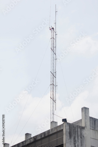 Signal towers located on the building for communication signals © theeraphong