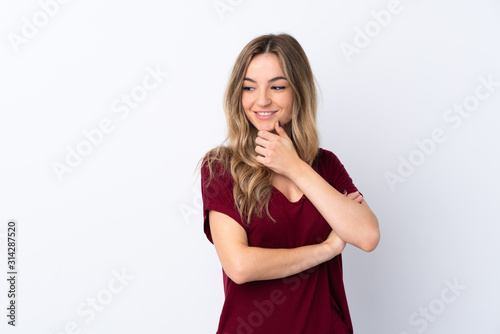 Young woman over isolated white background looking to the side