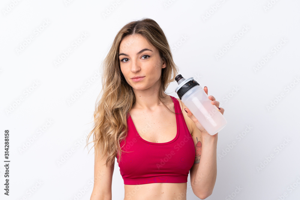 Young sport woman over isolated white background with sports water bottle Young sport woman over isolated white background with sports water bottle