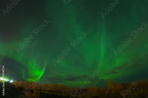 Aurora borealis in night northern sky. Ionization of air particl © Ludmila
