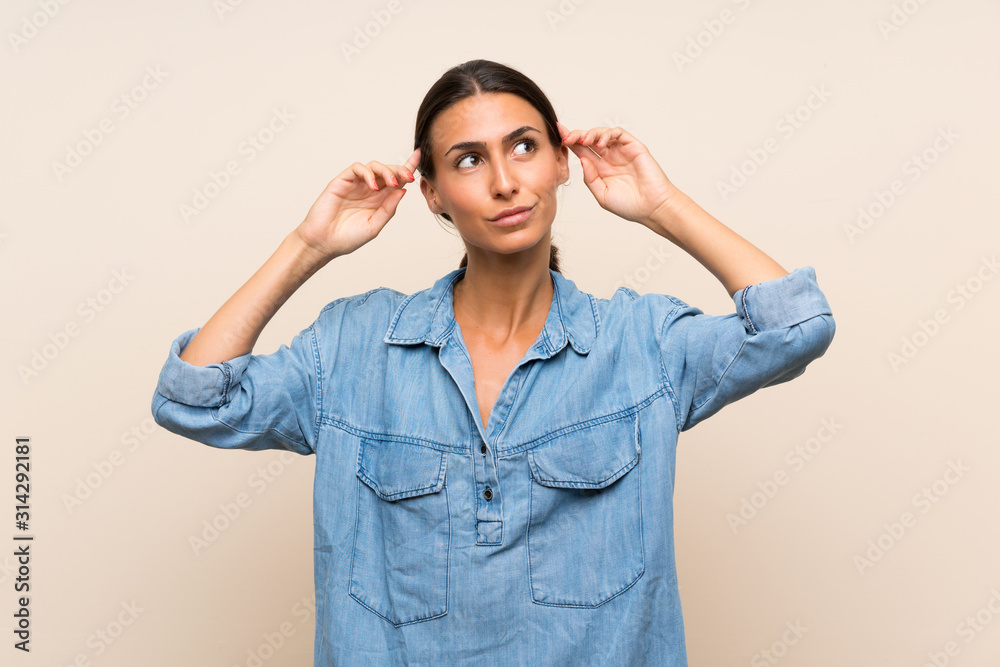 Young woman over isolated background having doubts and thinking Young woman over isolated background having doubts and thinking