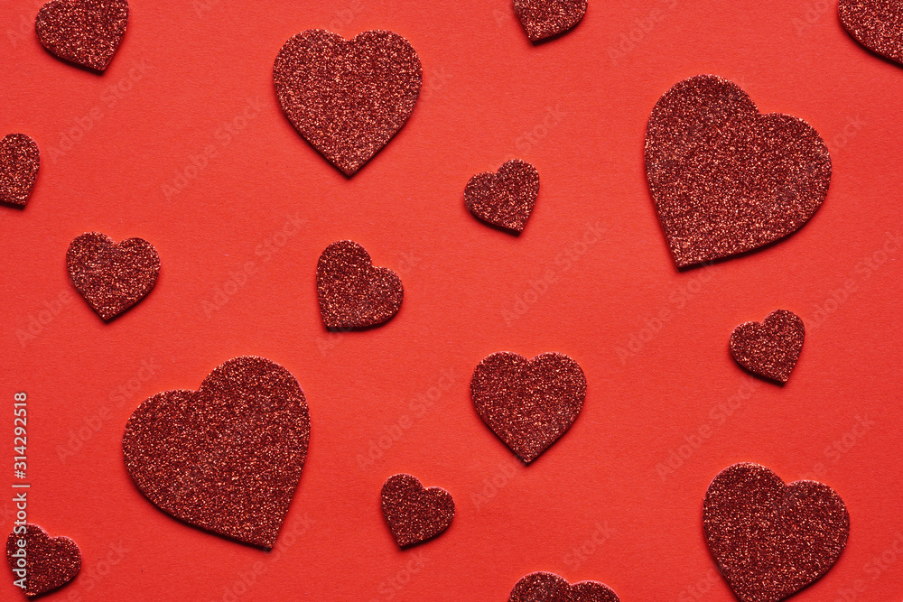 love themed red background with heart shape glitter hearts in various sizes - valentines day wedding or anniversary concept