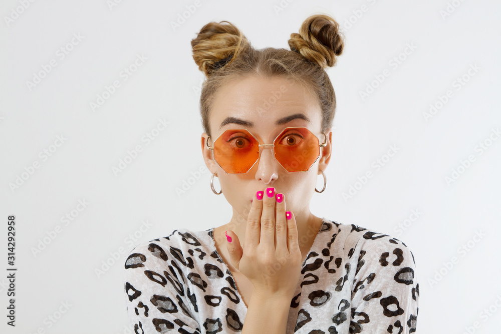 Close-up woman face. Fashion female closeup in trendy clothes isolated on white background. Summer fun time and summertime accessories. Funny girl.