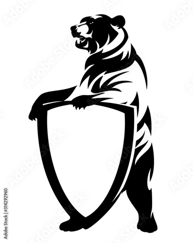 rearing up bear holding blank heraldic shield - antique style coat of arms black and white vector design