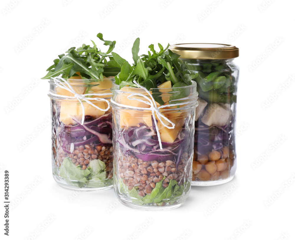 Glass jars with healthy meal isolated on white Glass jars with healthy meal isolated on white