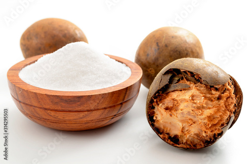 Obraz na płótnie Low calorie alternative to sugar and natural remedy for inflammatory disease and arthritis conceptual idea with Luo Han Guo or Monk fruit and bowl of powder sweetener isolated on white background w salonie