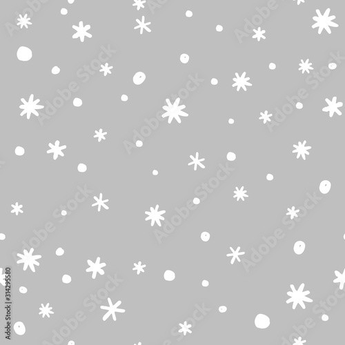 Seamless pattern with doodle hand drawn snowflakes. Vector illustration