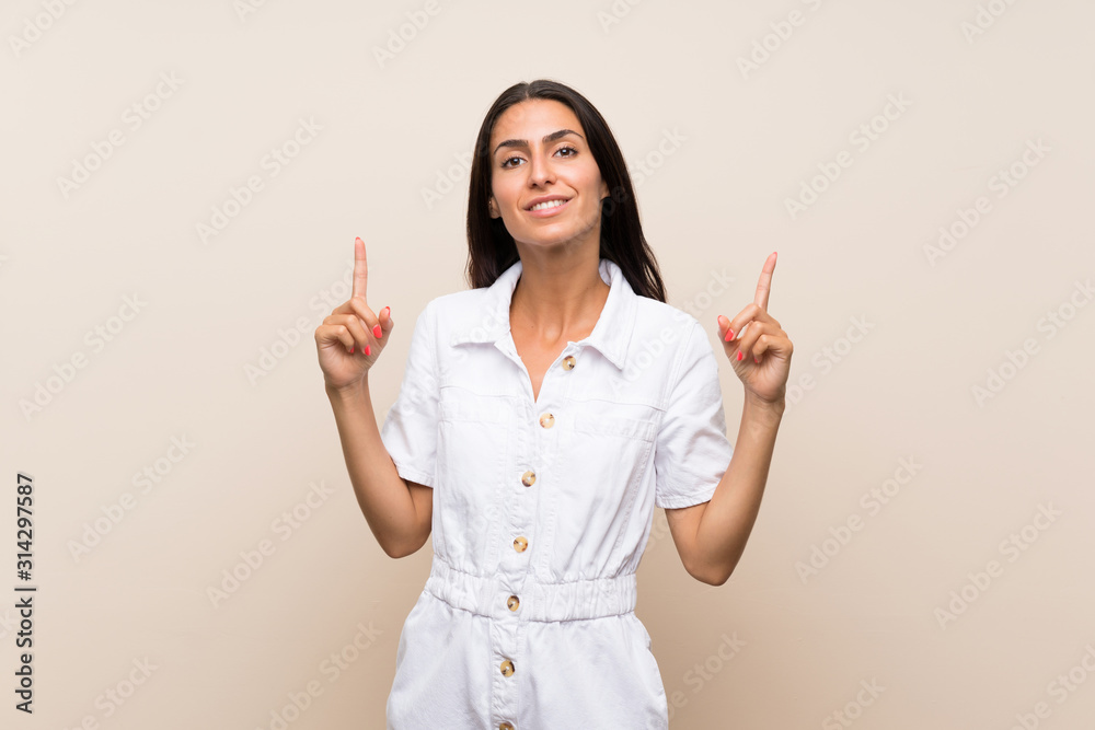 Young woman over isolated background pointing up a great idea Young woman over isolated background pointing up a great idea