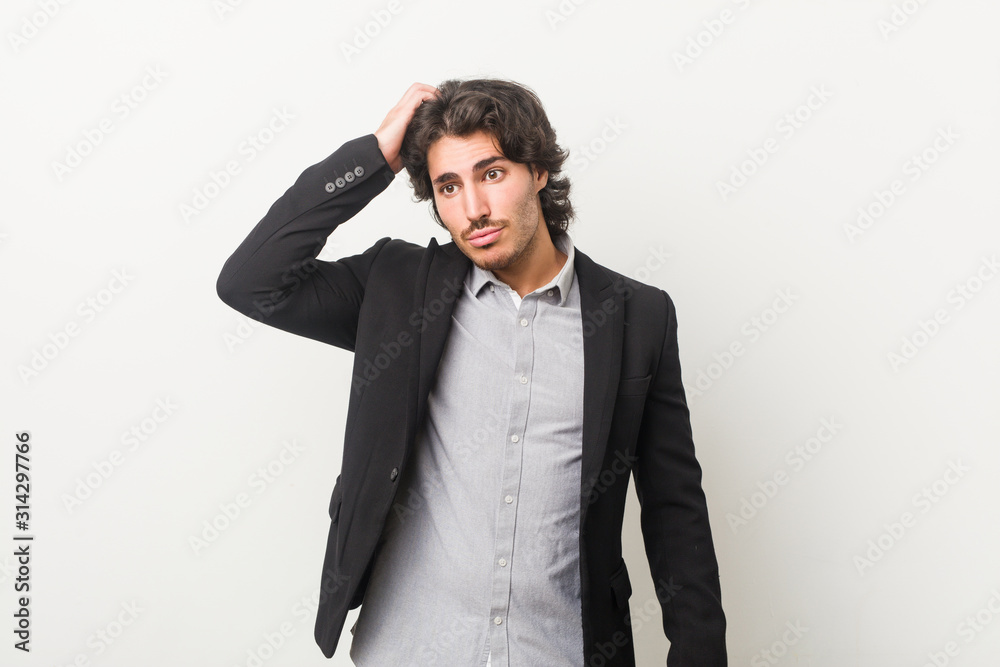 Young business man against a white background being shocked, she has remembered important meeting.