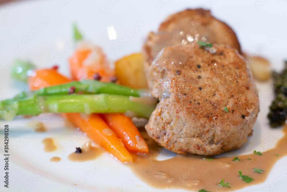pork steak with sauce on white plate pork steak with sauce on white plate
