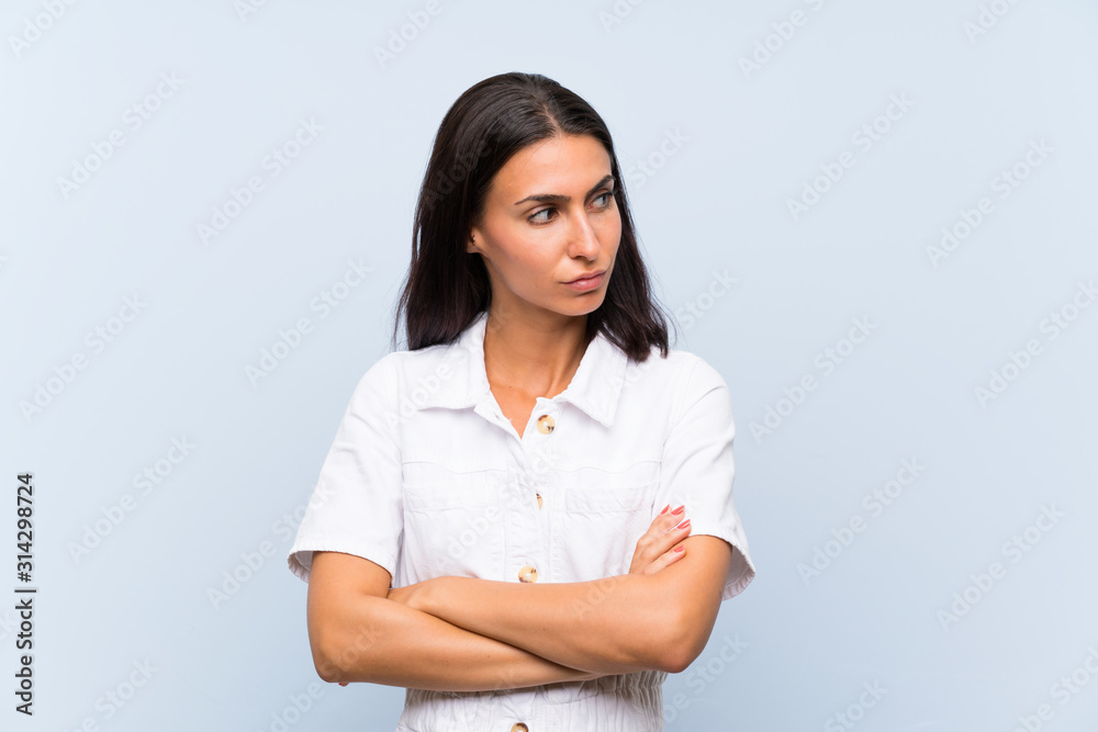 Young woman over isolated blue background thinking an idea Young woman over isolated blue background thinking an idea