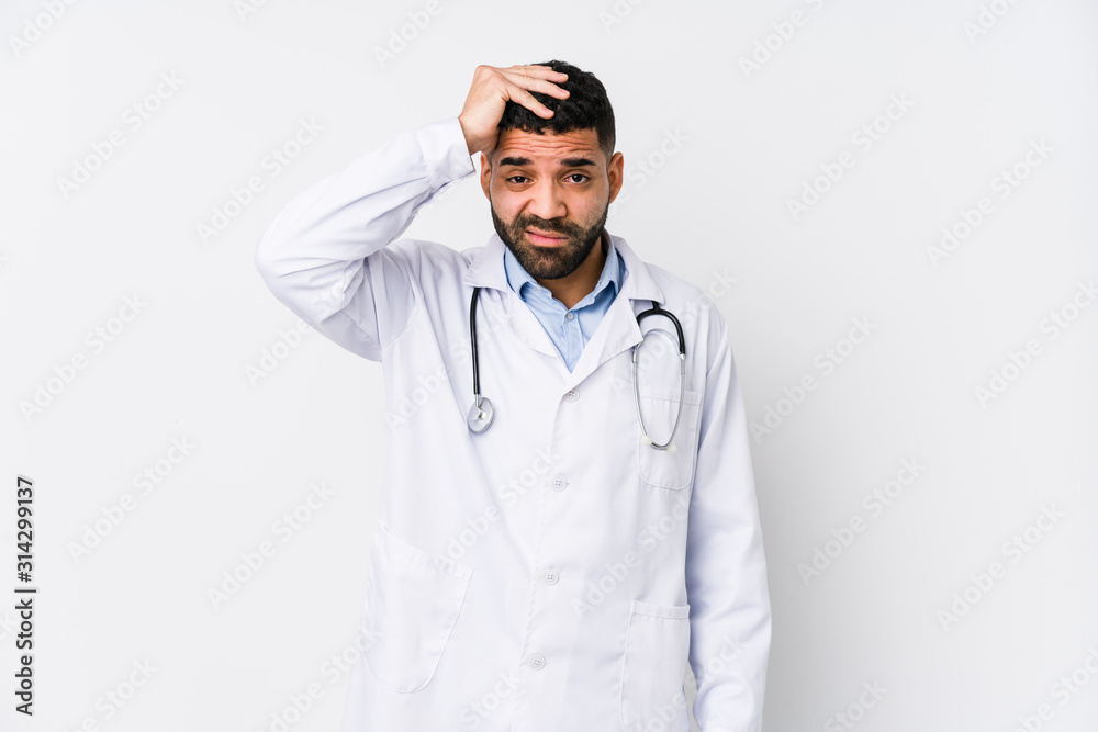 Young arabian doctor man isolated being shocked, she has remembered important meeting. Young arabian doctor man isolated being shocked, she has remembered important meeting.
