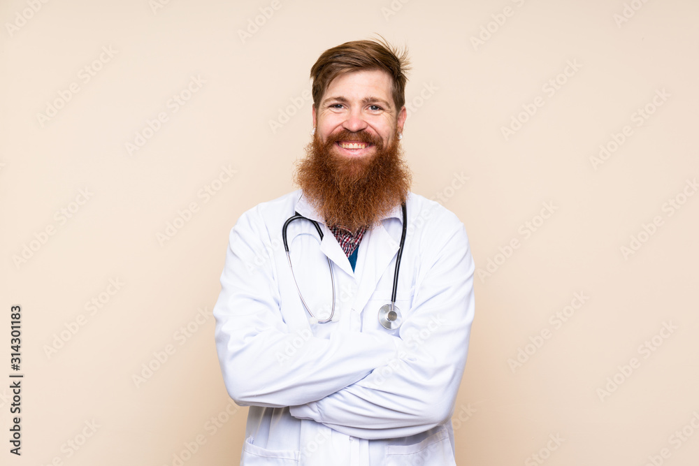 Redhead man with long beard over isolated background with doctor gown Redhead man with long beard over isolated background with doctor gown