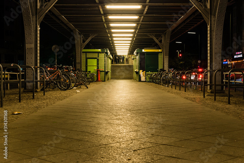 Stairs to the platform of a subway station in Berlin, entrance to the subway station Görlitzer Strasse in Berlin Kreuzberg, night shot, Berlin, Germany photo