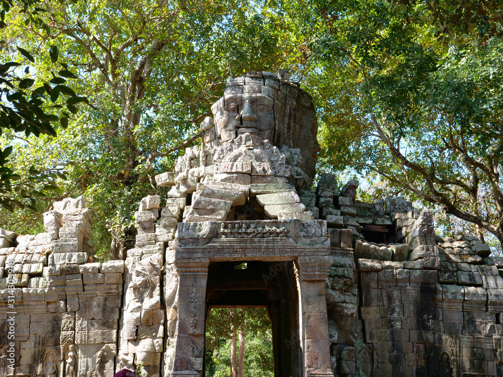 Fototapeta premium Stone rock door gate ruin at Banteay Kdei, part of the Angkor wat complex in Siem Reap, Cambodia