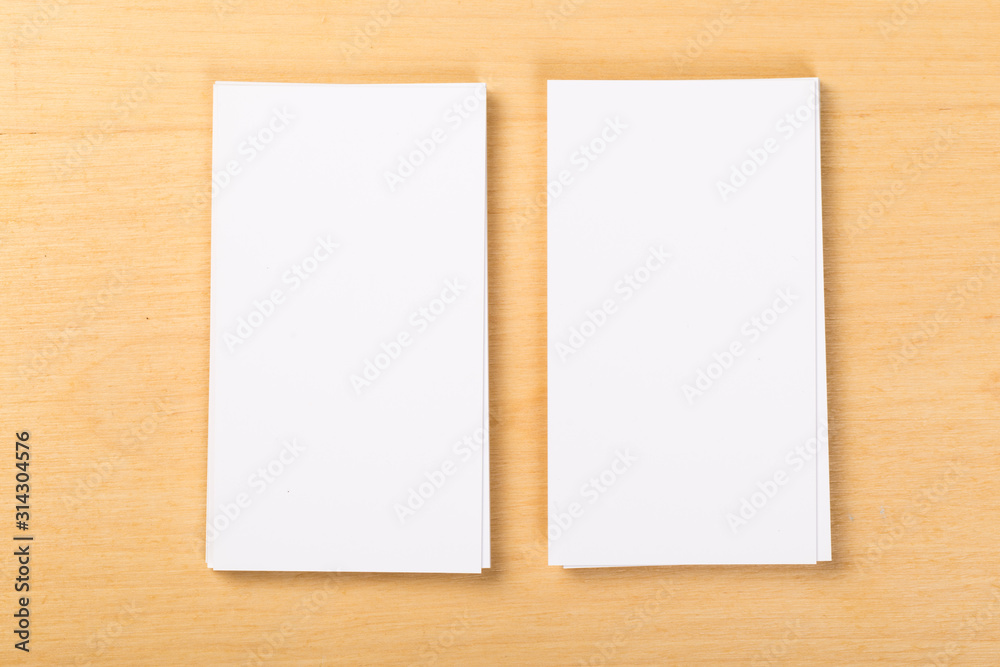 Photo of blank business cards on a general background. Template for identifier. View from above. mock up Photo of blank business cards on a general background. Template for identifier. View from above. mock up