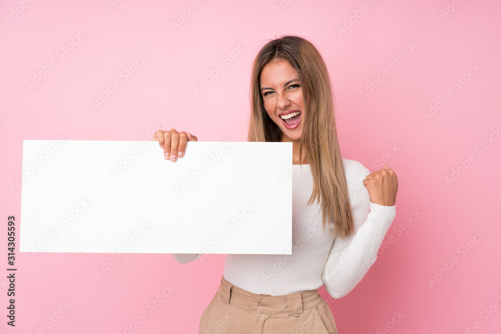 Young blonde woman over isolated pink background holding an empty white placard for insert a concept Young blonde woman over isolated pink background holding an empty white placard for insert a concept