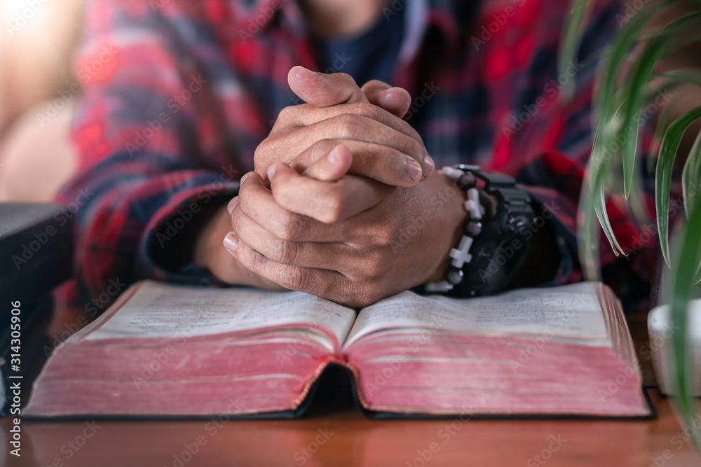 Fototapeta premium Sunday praying on Bible, Christian concept.
