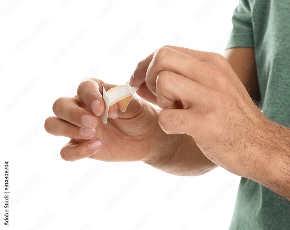Man with sticking plaster on white background, closeup Man with sticking plaster on white background, closeup
