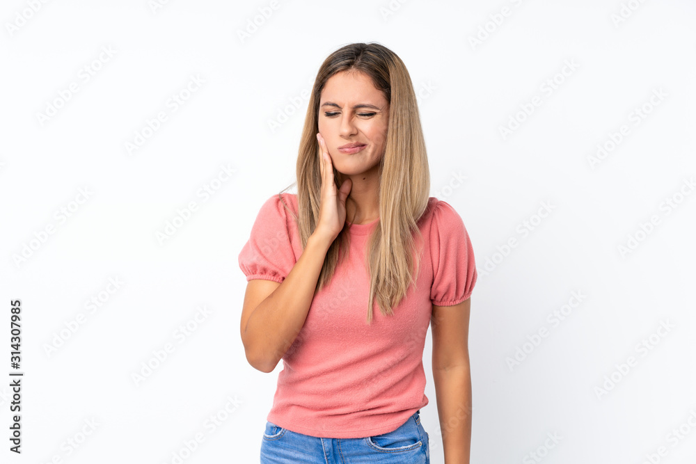 Young blonde woman over isolated white background with toothache Young blonde woman over isolated white background with toothache