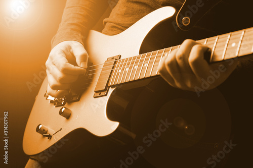 musician rock guitarist playing a guitar photo