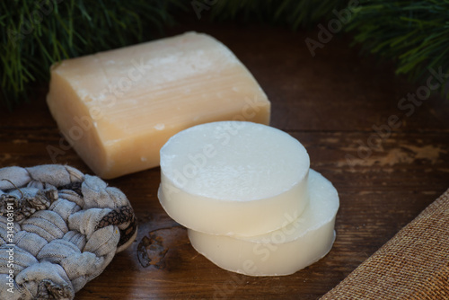 Donkey milk soap, on rustic background.,with tawashi. photo