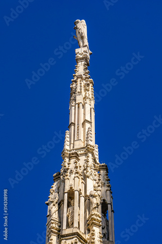 White marble spires on the roof of famous Cathedral Duomo di Milano in Milan, Italy © BGStock72