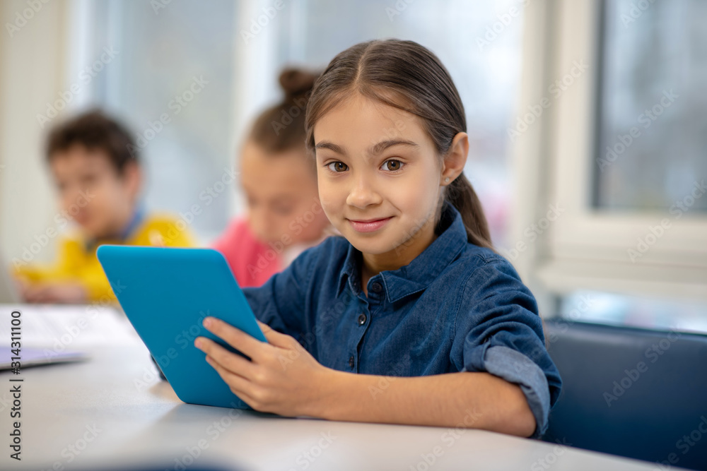 Little girl exploring the new learning technoligies Little girl exploring the new learning technoligies