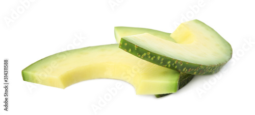 Slices of tasty ripe avocado on white background