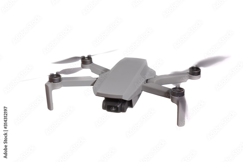 Modern quadcopter drone with a camera flying in the air. Isolated on white background. Modern quadcopter drone with a camera flying in the air. Isolated on white background.