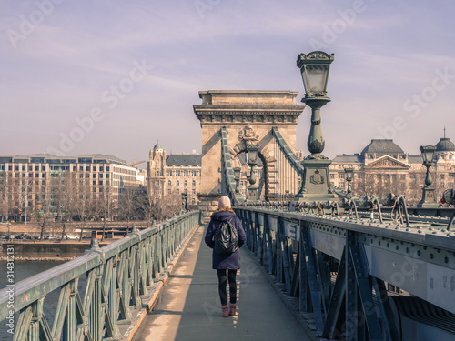 young woman on chain bridge in budapest