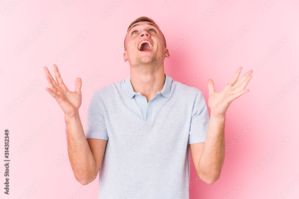 Young caucasian man isolated screaming to the sky, looking up, frustrated. Young caucasian man isolated screaming to the sky, looking up, frustrated.