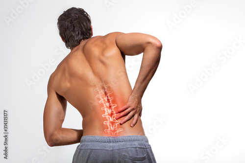 Human spine illustration,backache, man holding his hand in the back pain area