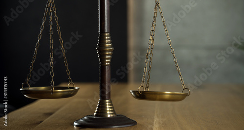 Symbol of law and justice on wooden table in lawyer office