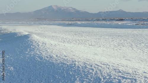 frazil on the sea surface, waves under the snow optical illusion. photo