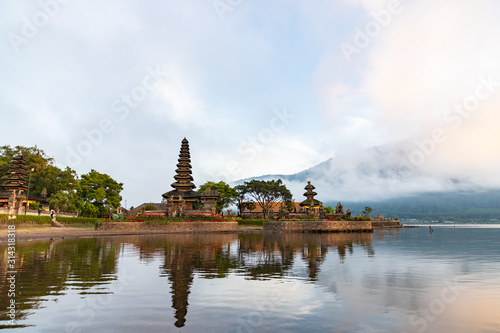 Morning at Pura Ulun Danu Bratan, Hindu temple on Bratan lake. Photo from boat, one of famous tourist attraction in Bali, Indonesia