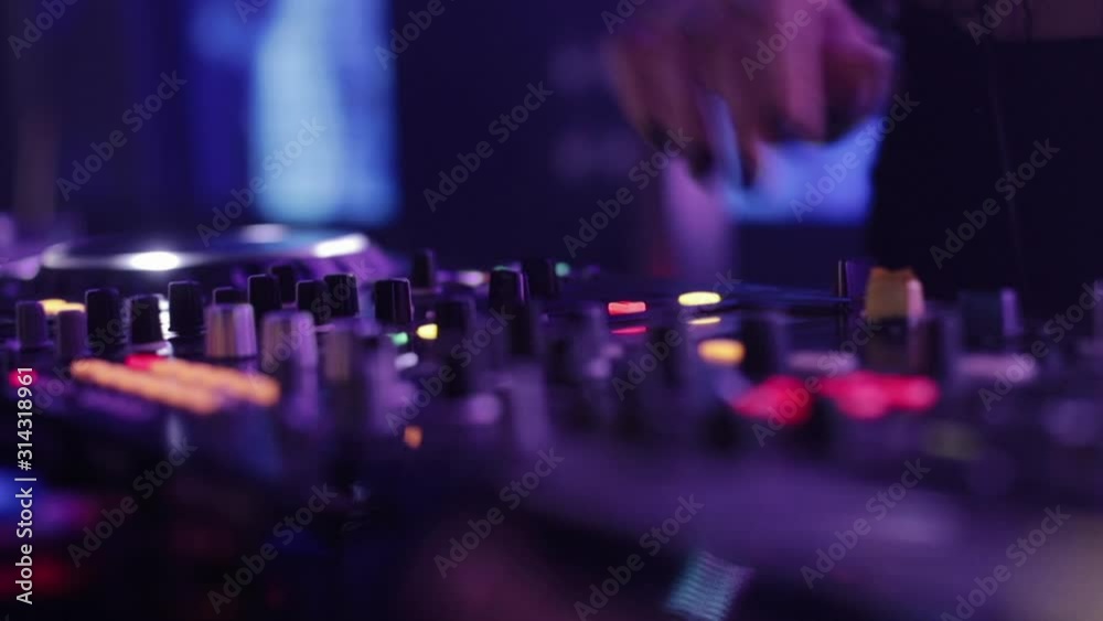 Girl Works As A DJ. Hands Close Up.