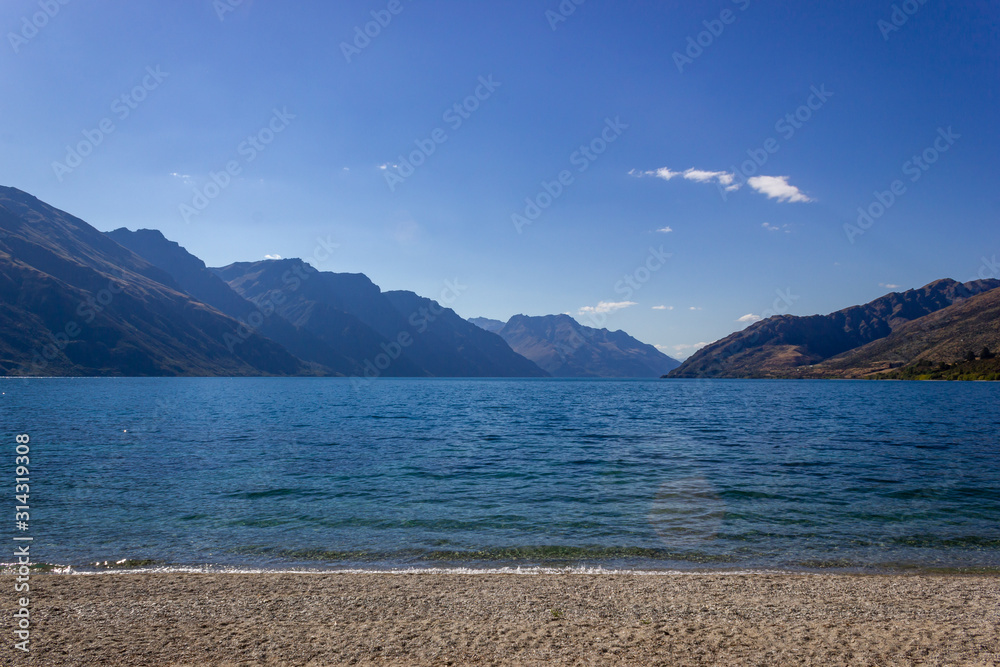 Lake Wakatipu on a free Campground outside of Queenstown during midday, New Zealand